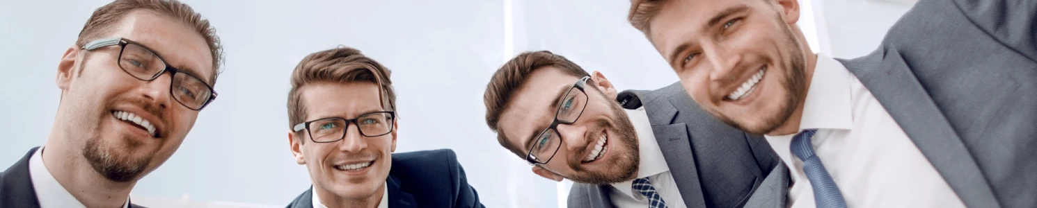 A group of male lawyers that are smiling