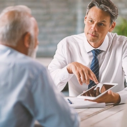 A man explaining something to another person