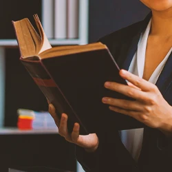 A lawyer holding a book