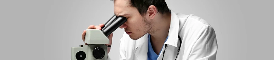 A doctor using a microscope