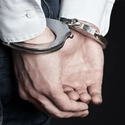 Hands contained in handcuffs 