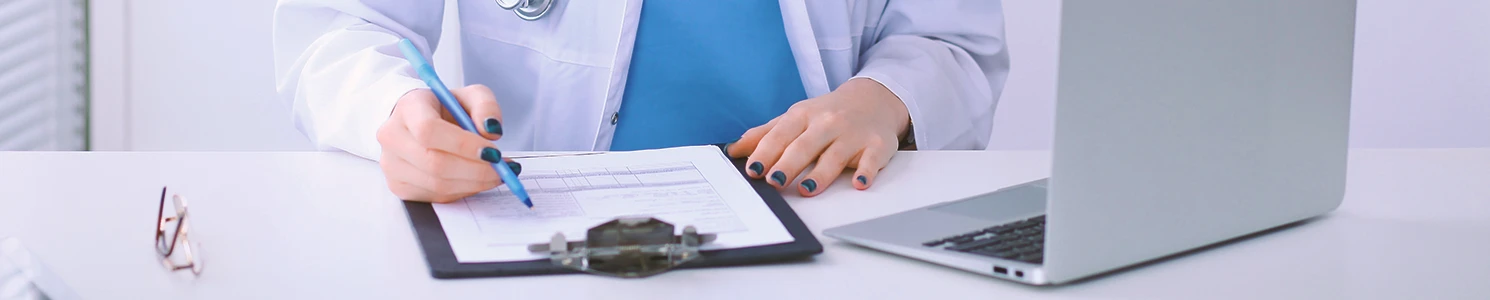 A doctor listing down the side effects of paraquat and glyphosate
