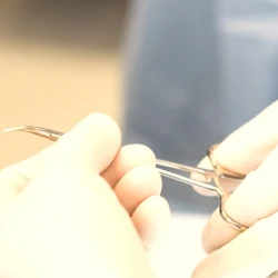 Surgeons passing a pair of scissors