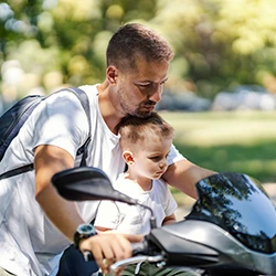 A father and son on a motorcycle