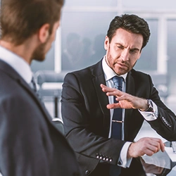 Two businessmen talking to eachother