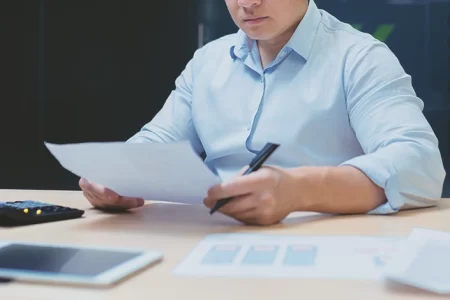 A businessman looking at paperwork