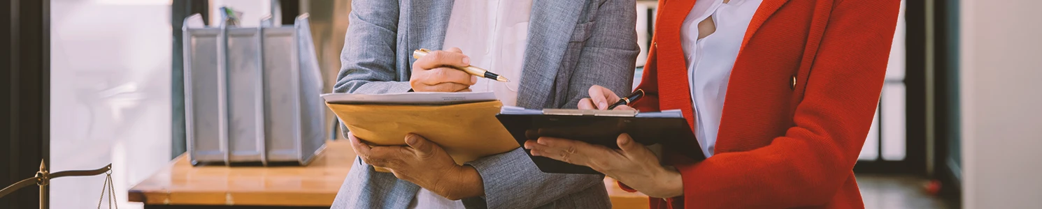 Lawyers studying defenses for an assault charge