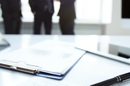 paper reports on table for lawsuit