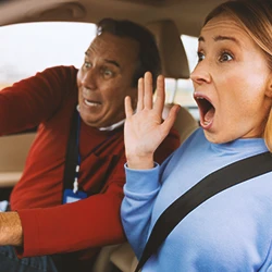 Two drivers in a car screaming
