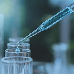 Close up shot of a scientist inspecting a liquid