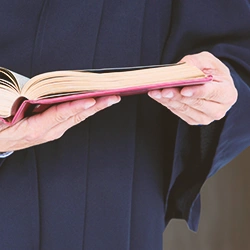 A judge reading out from a book