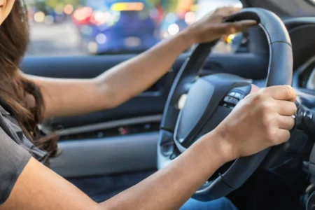 A woman driving a car in LA