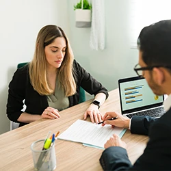 An image of a lawyer and his client talking