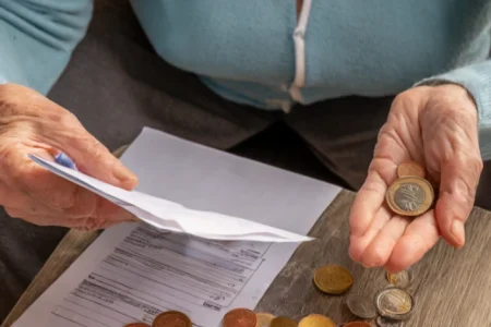 An old woman on debt due to financial abuse