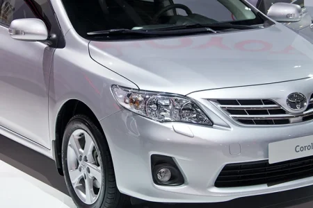 A silver Toyota Corolla in a show room