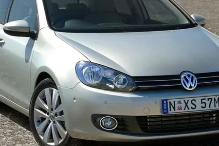 A silver Volkswagen car parked on the road