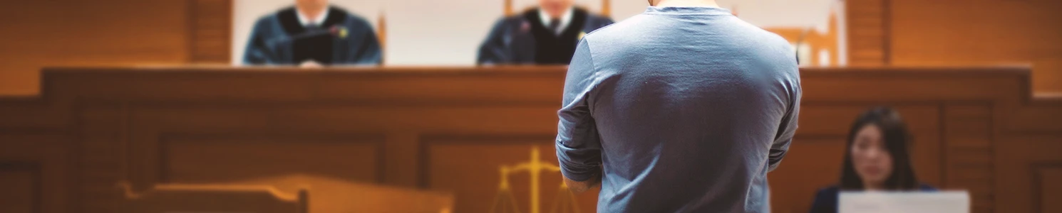 A person in court getting penalized for involuntary manslaughter