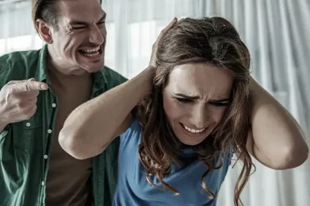 A man assaulting a woman