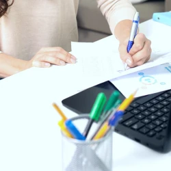 An attorney reading paperwork in an office