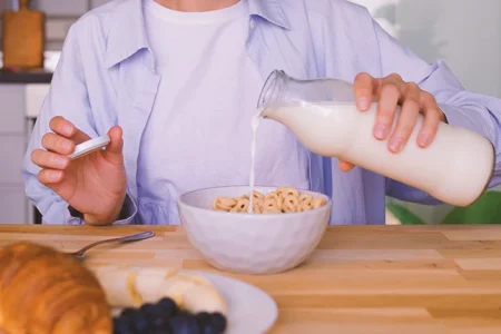 A person eating cereal that is high in glyphosate