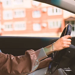 A woman driving a car outside