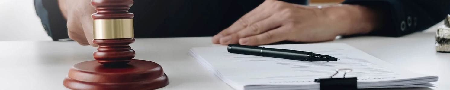 A document and a gavel inside an office 