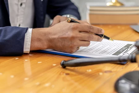 A lawyer writing in his office