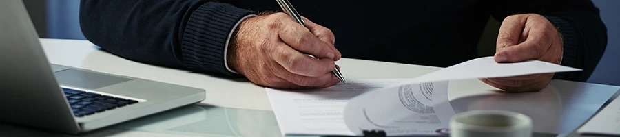 A man reading a paper about what is a protected class