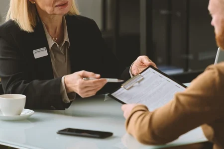 A lawyer explaining to a client what an Adverse Employment Action is