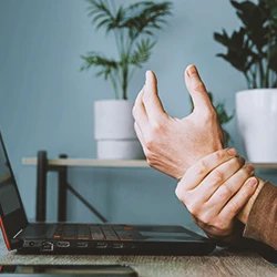 A person suffering from carpal tunnel syndrome