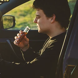 A driver drinking inside the car
