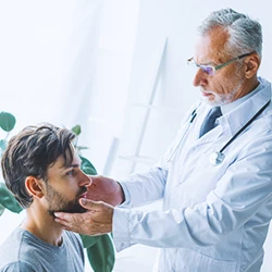 A doctor checking a patient's lymphatic nodes