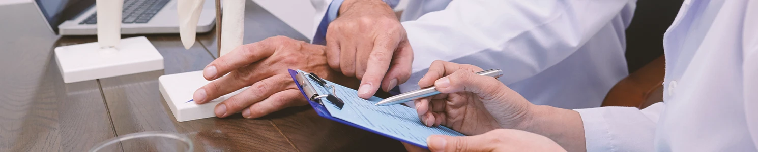 Doctors discussing organ perforation that is from surgical mesh