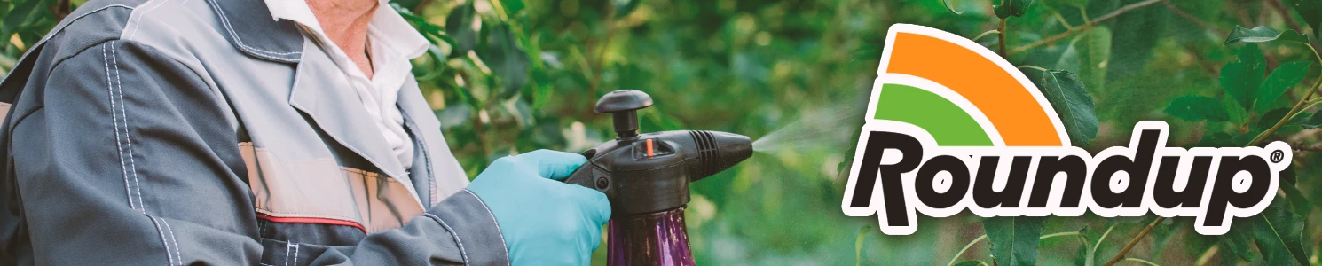 A farmer spraying herbicide with the Roundup logo at the foreground of the image