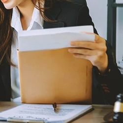 A woman reading up on standings on personal injury cases