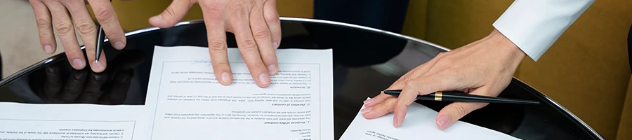 Two people discussing burden of proof during a talcum claim