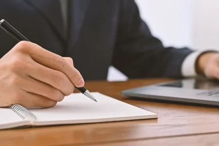 A lawyer writing down notes