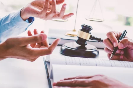 A lawyer and a person talking to each other