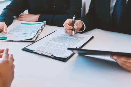 Two businessmen looking at paperwork