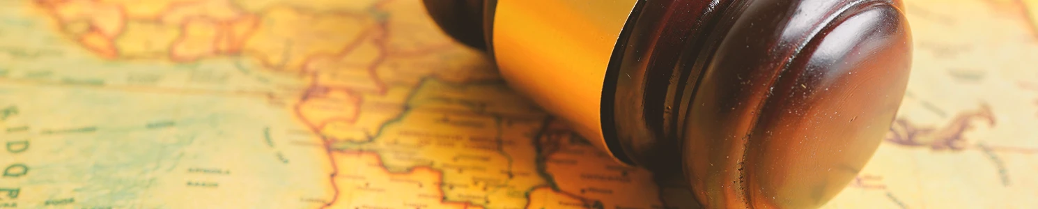 A lawyer's gavel on a world map