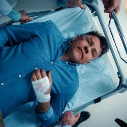 An injured driver getting medical help
