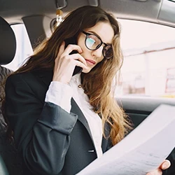 A woman making a call about her suspended license