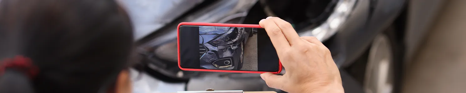 Taking a photo of a car's damaged part 