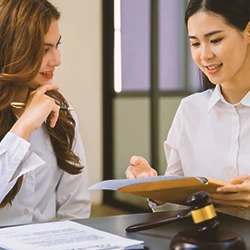 A lawyer discussing arbitration to a client