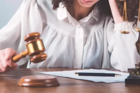 A female lawyer holding a gavel