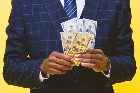 A businessman holding money