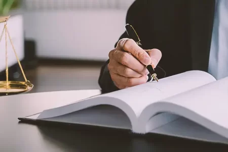 A lawyer writing down notes