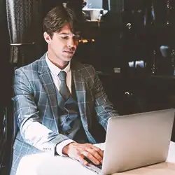 A businessman using a laptop