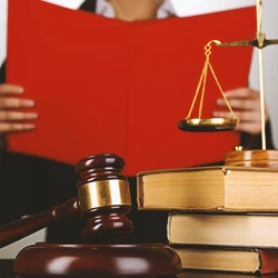 A judge reading out a verdict from a preliminary hearing