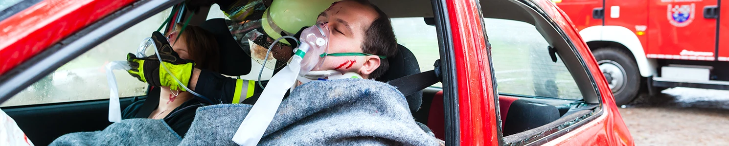 An ambulance helping the driver and the passenger in a recent accident